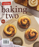 America's Test Kitchen baking magazine cover featuring three golden cinnamon buns in a baking pan and a rolled pastry with small batch recipes for two