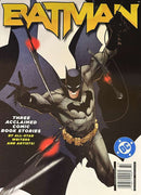 Batman Magazine cover featuring Batman in action with a dramatic comic book design and bold yellow title lettering surrounded by dark illustrated artwork