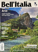 Bell Italia Magazine cover featuring Arco in Trentino with a river castle and mountain landscape surrounded by lush greenery and Italian travel story headlines
