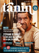 Tanin magazine cover featuring a bearded man resting his chin on his hand with French headlines about champagne and holiday gift ideas