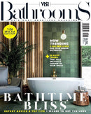 VISI Bathrooms magazine cover featuring a modern bathroom with a freestanding white bathtub, green tiled wall, wooden accents, and indoor plants promoting trending bathroom looks and expert advice.