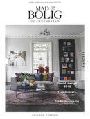 Mad og Bolig Scandinavian magazine cover showing a stylish Scandinavian living room with modern decor and summer edition features on Danish design and cooking