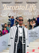Toronto Life magazine cover featuring a stylish man in sunglasses and a black and white patterned outfit on grand stairs with Best Dressed headline