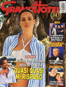 Grand Hotel Magazine cover featuring a woman in a blue striped shirt with celebrity stories and colorful summer headlines on an Italian magazine cover
