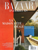 Harper’s Bazaar Interieurs France Magazine cover featuring a modern summer house entrance with a woman standing in the doorway and bold red blue and white typography