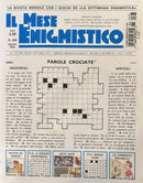 IL Mese Enigmistico Magazine cover featuring Italian crossword puzzles word games illustrated quiz panels and monthly puzzle content in a blue and white design