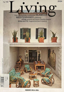 Living Magazine cover featuring a sunlit Mediterranean cafe courtyard with green patterned wicker chairs wooden tables and potted plants among Italian feature text