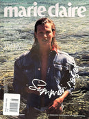 Marie Claire Italia Magazine cover featuring a woman in a dark denim jacket standing in shallow water with Italian cover lines and a white handwritten title