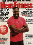 Mens Fitness UK Magazine cover featuring a smiling man in a red shirt with headlines about strength training health and building a stronger body