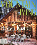 Mountain Living Magazine cover featuring a rustic mountain lodge restaurant with outdoor dining string lights and forest scenery