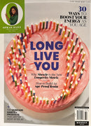 Oprah Daily Magazine cover featuring a pink birthday cake with colorful candles and headlines about longevity energy and wellness Magazines