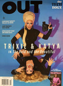 Out Magazine cover featuring Trixie and Katya in a colorful drag themed feature with bold OUT lettering and LGBTQ culture headlines on a blue background