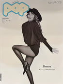 Pop Magazine cover featuring a black and white fashion portrait of a woman in a hat bodysuit and tights with Shania and 700 plus pages on the cover