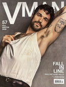 V Man Magazine cover featuring a bearded man in a white tank top with a raised tattooed arm and Fall in Line issue 57 cover text